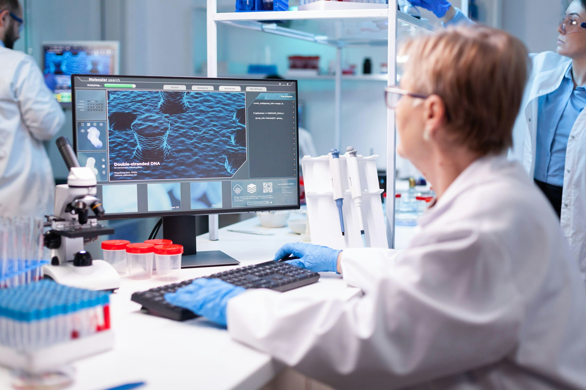 Scientist conducting molecular research, studying the structure and function of biological molecules including DNA, RNA, and proteins essential for life processes.